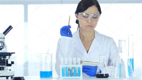 scientist  laboratory reading documents paperwork  result