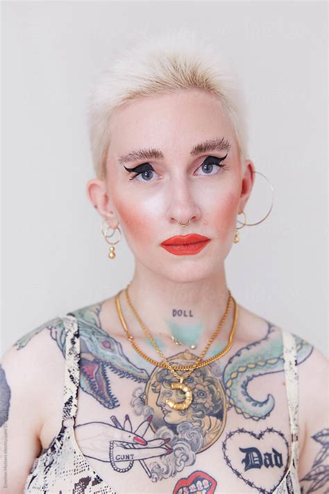 A Strong Portrait Of A Beautiful And Eccentric Woman With Body Tattoos