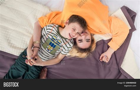 mother son on bed image and photo free trial bigstock