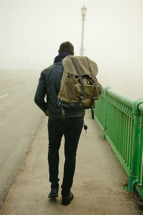 man walking    fog  stocksy contributor kristine