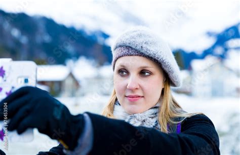 Blonde Girl Taking A Selfie Photo On The Swiss Alpine Alps Stock
