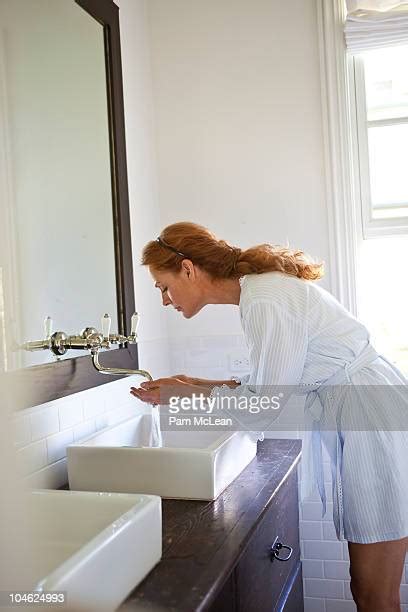 Older Woman Washing Face Photos And Premium High Res Pictures Getty