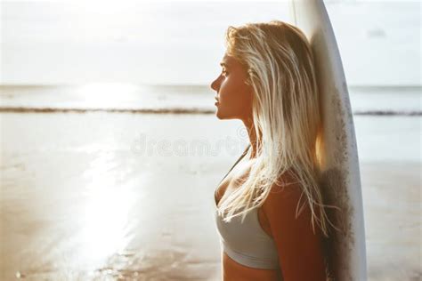 Surfer Girl Surfing Looking At Ocean Beach Sunset Stock Image Image