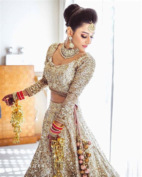real indian brides  wore   gold outfit   wedding