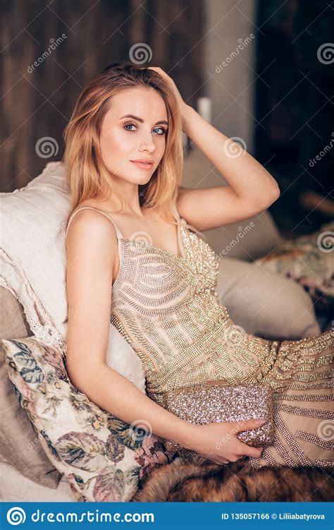 Fashion Photo Of A Luxury Beautiful Blonde Woman In A Long