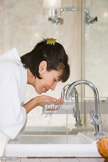 40s Woman Washing Face Photos And Premium High Res Pictures Getty Images