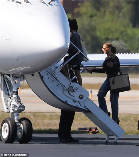 Jennifer Lopez Rocks A Pair Of Sky High Heels As She Boards A Private