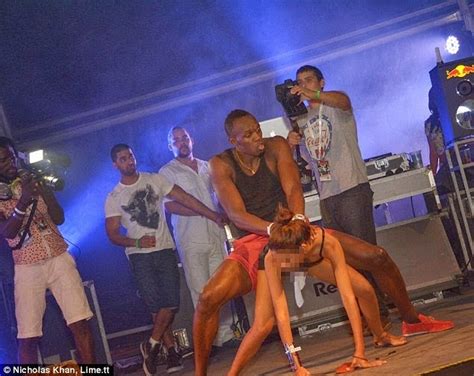 athlete usian bolt gets down grinding hard with a girl at carnival the amy show