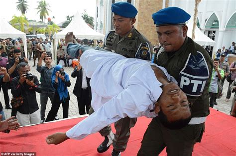 indonesian man faints as he receives 100 lashes in public for having