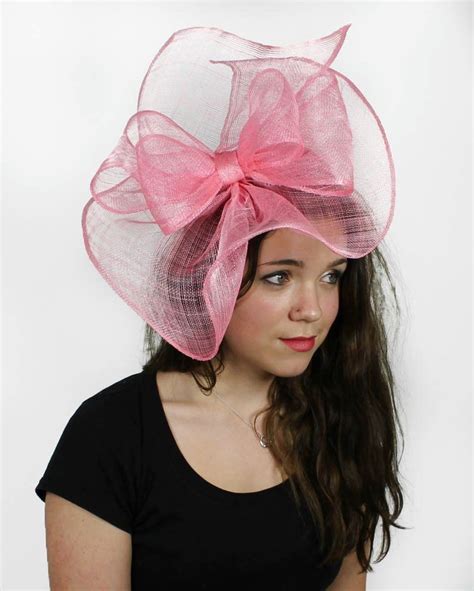 pink fascinator hat  weddings occasions  parties