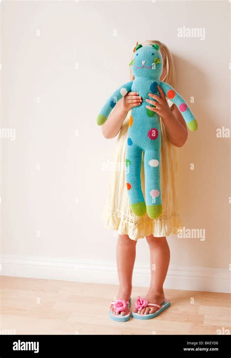 girl holding stuffed animal  front   stock photo alamy