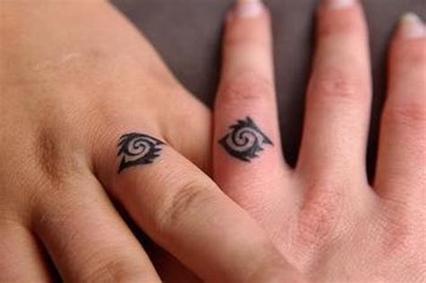 picture of tribal married couple matching tattoos look very original and unusual
