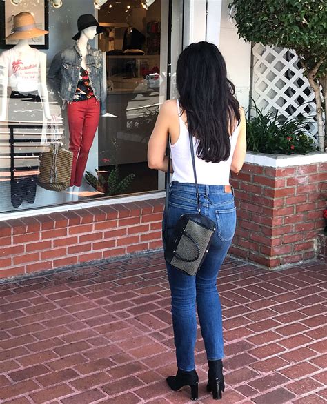 aimee garcia in a white tank top and denim jeans 03