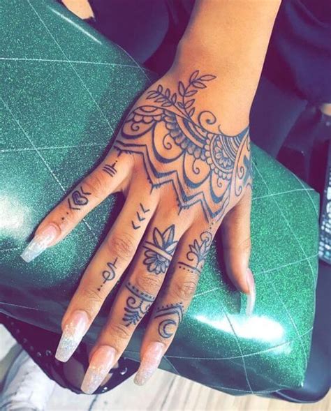 20 Hand Tattoo Ideas From The Celebrities That Love Ink Mandala Hand