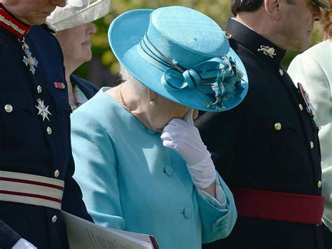 the queen becomes visibly emotional at memorial for fallen