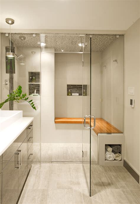 the entry into this contemporary steam shower in bryn mawr pa is featuring teak wood bench
