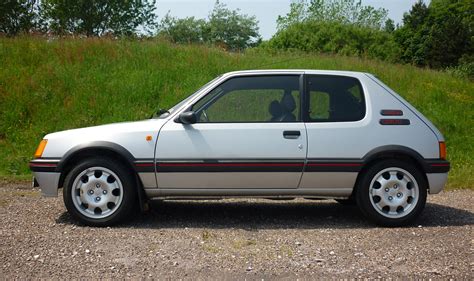 peugeot  gti achieves record price  classic car auction