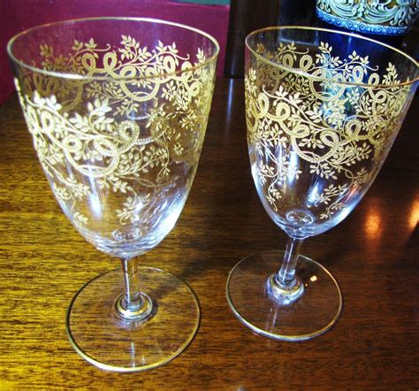 beautiful pair of heavily decorated gilt wine glasses decorated wine