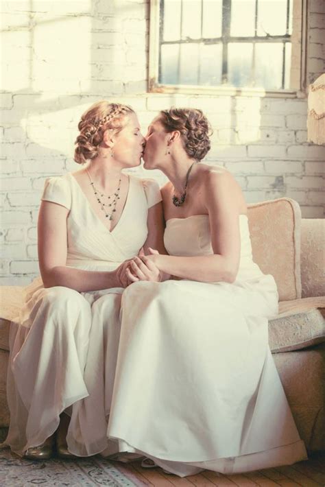 a first look or first meeting kiss in the bridal suite at a fall