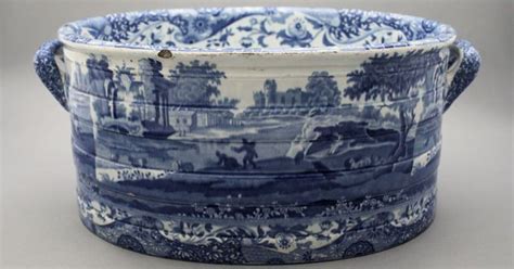 large blue  white bowl sitting  top   table