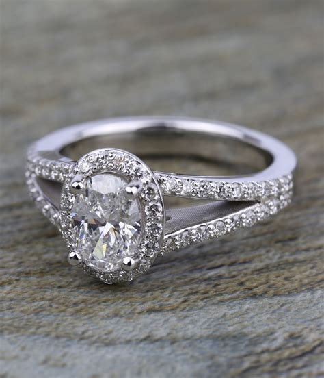 A Beautiful 1 Carat Oval Diamond Halo Split Shank Engagement Ring