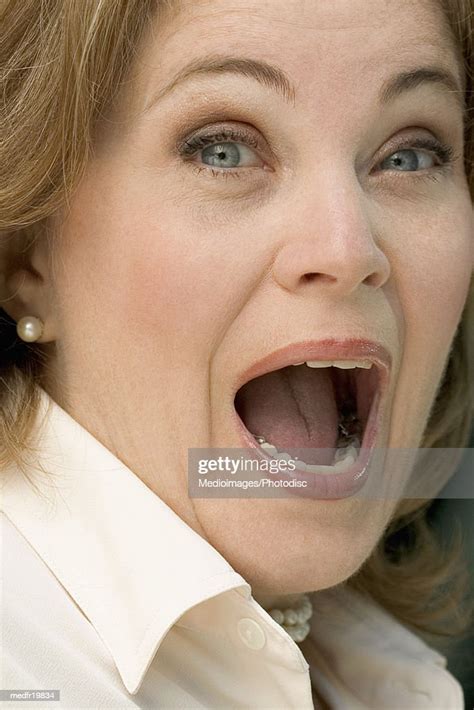 Portrait Of A Mature Businesswoman With Her Mouth Open Photo Getty Images