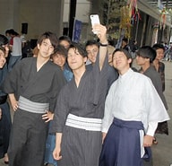 Image result for Young men wrapped up in popularity of traditional Japanese clothing. Size: 192 x 185. Source: mainichi.jp