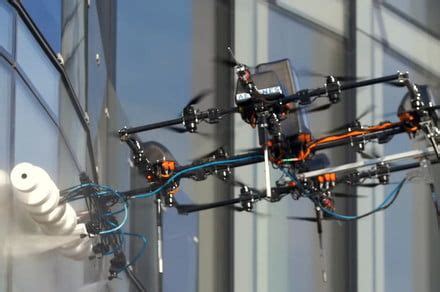 dangle   window washing drone  towers  replace human cleaners washing windows