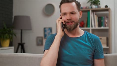 handsome man  talking   phone  smiling  home portrait