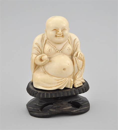carved ivory figure  seated buddha  sold