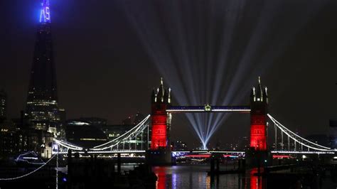 a light show is seen over tower bridge on new year s eve amid the