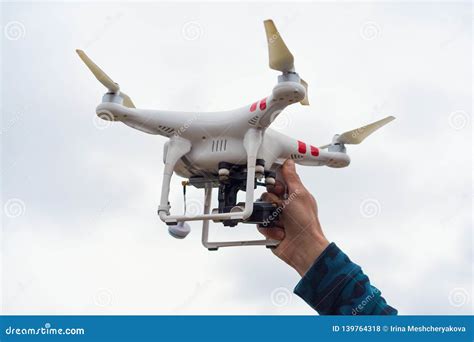 human hand launching flying quadcopter drone  video  photo capture   background