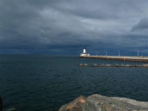Duluth Mn Stormy Skies Over Duluth Lighthouse At Canal Park In