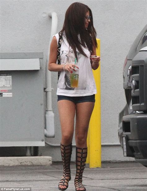selena gomez steps out in knee high gladiator sandals and hotpants a