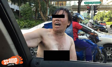 topless woman on nicoll highway also went around screaming and hitting vehicles stomp