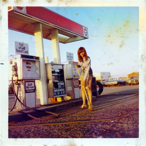 sweeping girl at gas station in 1968 ~ vintage everyday