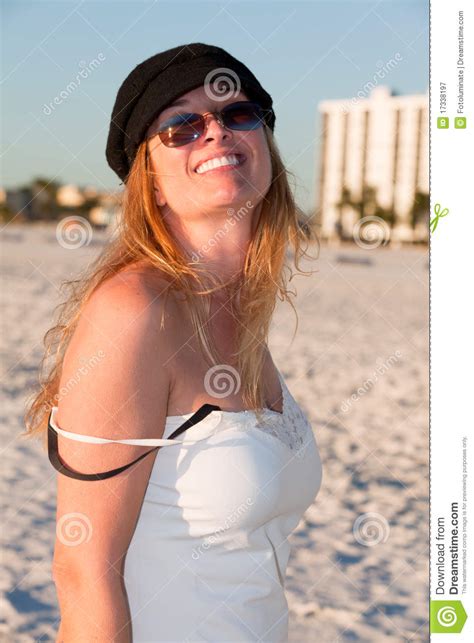 attractive middle aged blond woman at the beach stock
