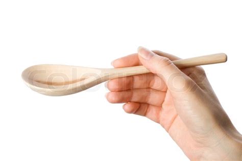 woman holding wooden spoon   hand stock photo colourbox
