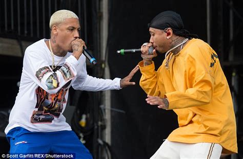 busty blonde flirts and caresses tyga s hand at wireless daily mail