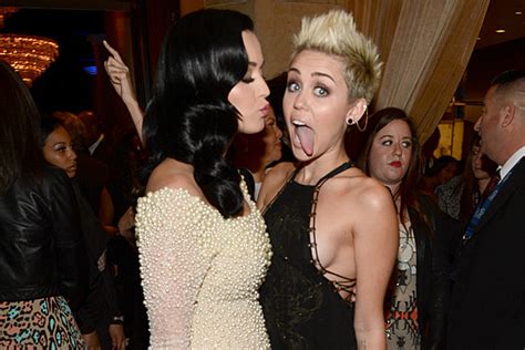 miley cyrus gets kiss from katy perry but denied the tongue