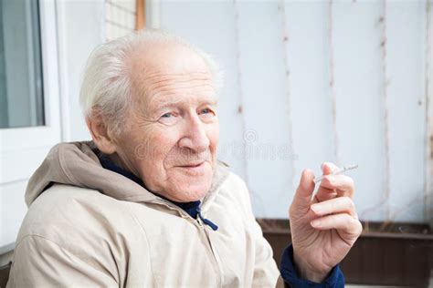 Smiling Old Man With A Cigarette Stock Image Image Of Holding Mature