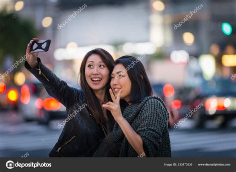Two Girlfriends Meeting Outdoors Having Fun Japanese People Bonding