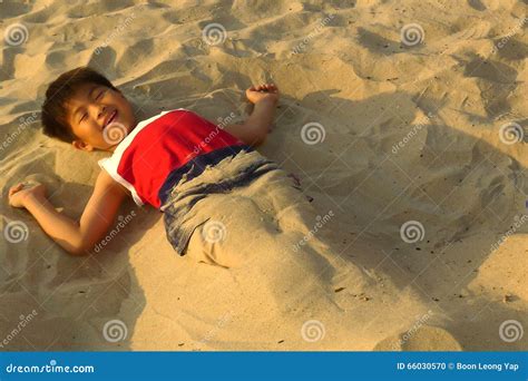 happy boy lying    beach stock photo image