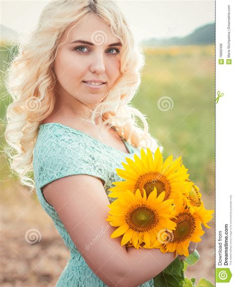 Portrait Of A Beautiful Smiling Blonde Girl Outdoors Stock