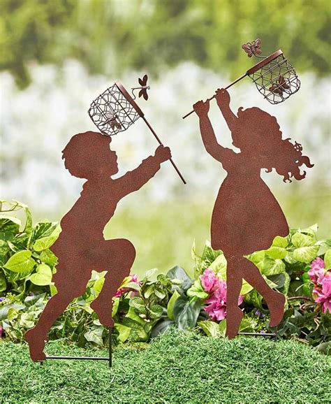 boy girl kids catching butterflies silhouettes metal garden stake
