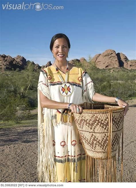 Native American Woman In Traditional Clothing With Hand