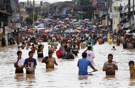 philippine floods nineteen dead  rain continues democratic
