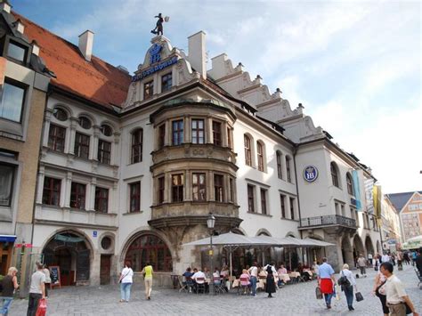 hofbrauhaus munich germany hands   worlds  famous beer
