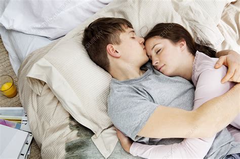 Couple Embracing Laying In Bed Stock Image F003 6895 Science