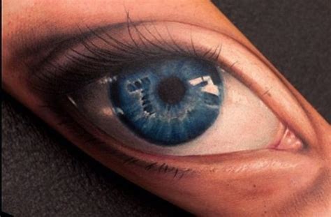 realistic blue eye tattoo on arm tattooimages